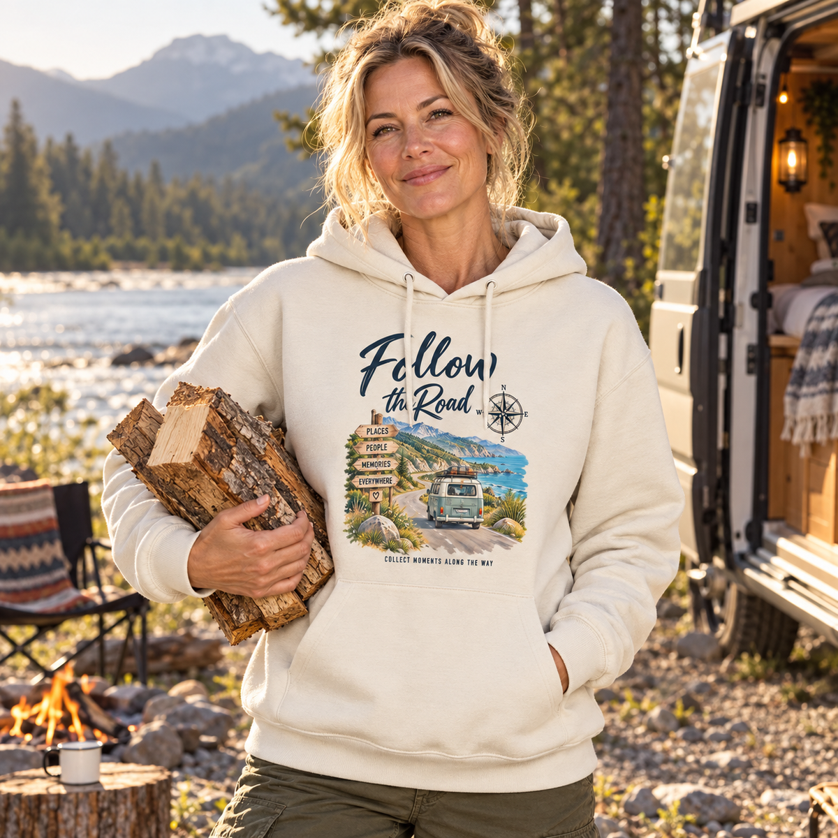 Frau im naturfarbenen Bio Hoodie mit Follow the Road Frontprint am Flusscamp
