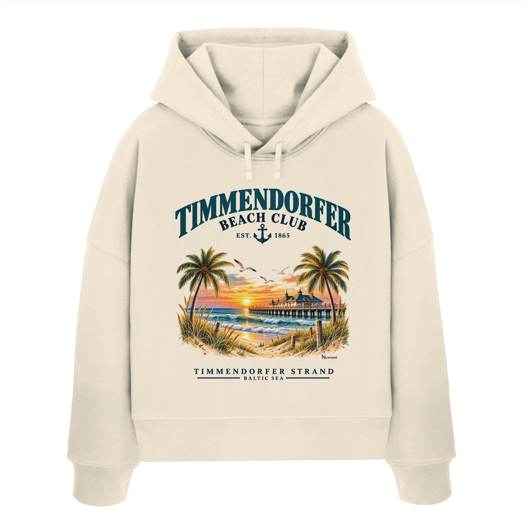 Originalmockup: Timmendorfer Beach Club Damen Bio-Boxcut-Hoodie in Natural Raw, Vorderansicht mit maritimem Frontprint, Palmen, Seebrücke und Meer.